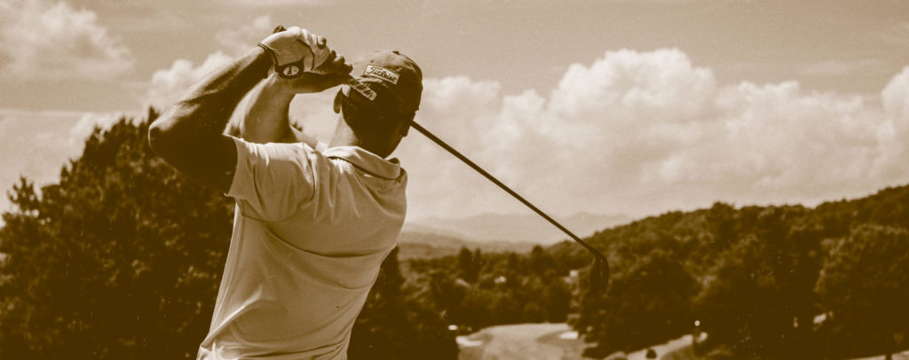 Golf instructor providing expert guidance to a student's swing