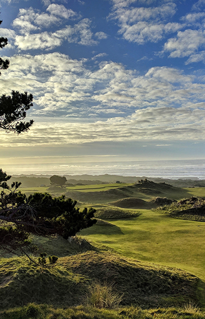 Breathtaking view of a golf course nestled amidst rolling hills