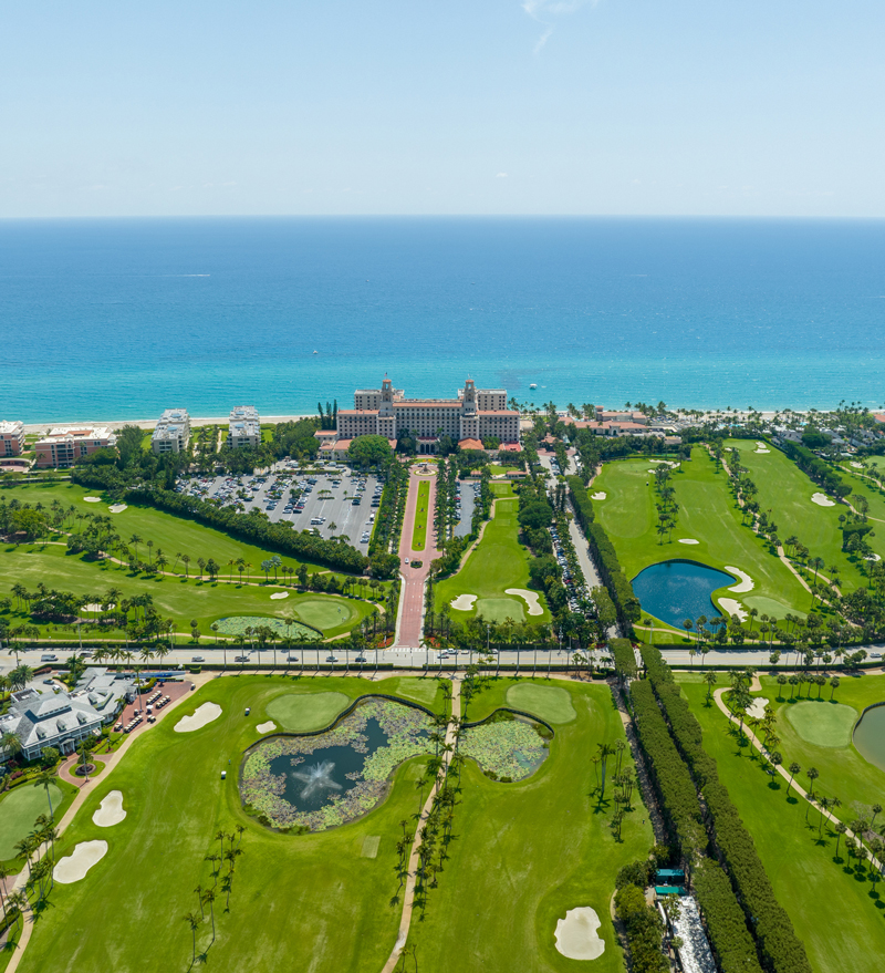 Golf course with lush green fairways and well-manicured greens